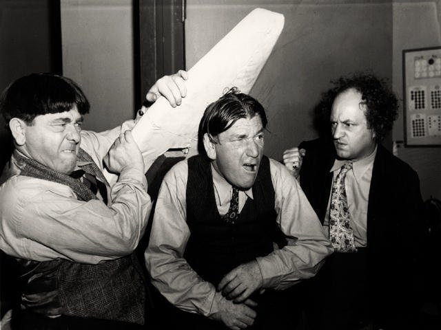 Shemp with his younger brother Moe Howard and partner Larry Fine in Sing a Song of Six Pants in 1947