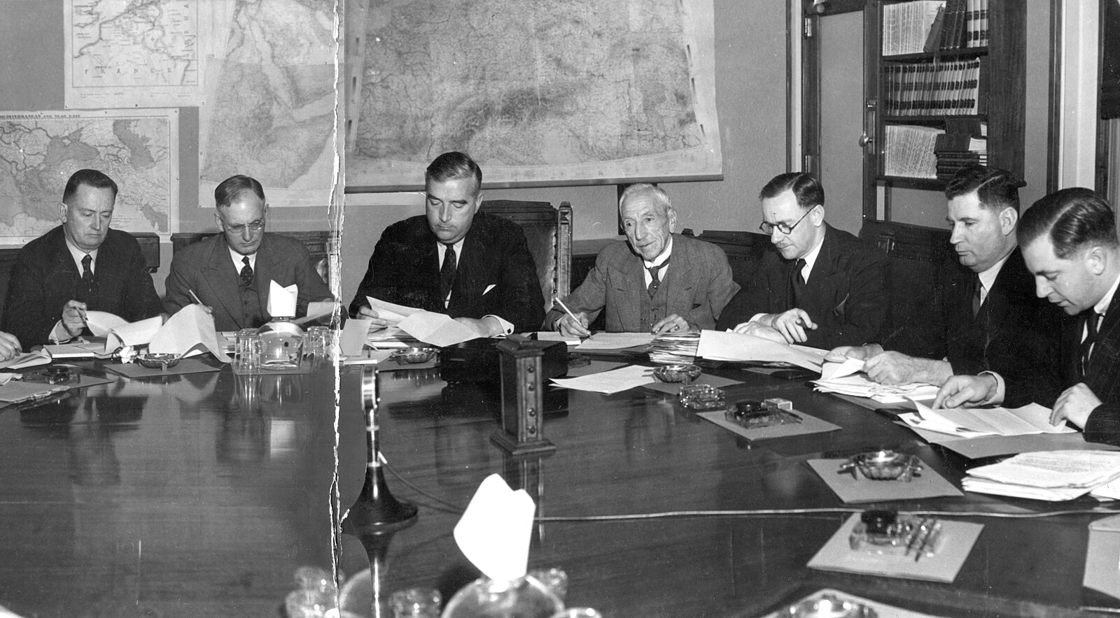 Meeting of the Advisory War Council shortly after its establishment, featuring six past, present, and future prime ministers seated together. From left to right: Frank Forde (Deputy Leader of the Opposition), John Curtin (Leader of the Opposition), Robert Menzies (Prime Minister and Minister for Defence Co-ordination), Billy Hughes (Attorney-General and Minister for the Navy), Percy Spender (Minister for the Army), Arthur Fadden (Treasurer), and Harold Holt (Minister for Labour and National Service). Six prime ministers.jpg