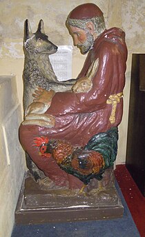 Statue of Francis of Assisi with the Wolf of Gubbio Statue St Margaret of Antioch Northam.jpg