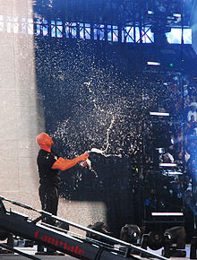 Austin is noted for his signature "beer smash", seen here at WrestleMania 25. Stone Cold smashing beers.jpg
