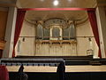 Pipe organ and stage of concert hall seen in 2013