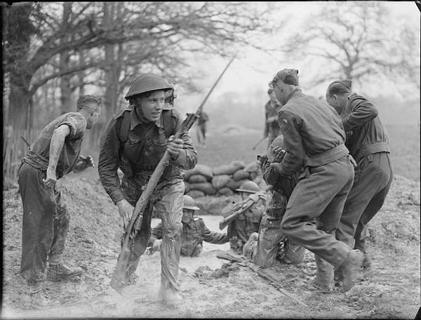 A soldier emerges from the 'mud bath' during training at the 44th Divisional battle school at Dene Park, Tonbridge in Kent, 22 April 1942.