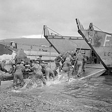 A Bofors gun of 91st LAA Rgt being loaded onto a landing craft in a combined operations training exercise in Scotland on 17 November 1942. The British Army in the United Kingdom 1939-45 H25395.jpg