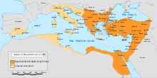 A colored map using burnt and light orange to represent the re-conquest of territory by Emperor Justinian.