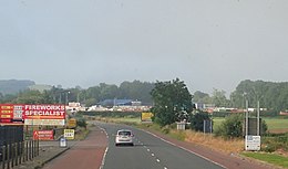 2019 view from the Armagh-side of the Killeen border crossing--on the B113, or Old Dublin Road--where McGlinchey was handed by the Gardai to the RUC, and then back again; the border itself lies approximately by the yellow sign to the right of the road The Killeen Border Crossing on the B113 (Dublin Road) (geograph 6229447).jpg