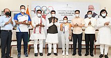 The Union Minister for Information & Broadcasting, Youth Affairs and Sports, Anurag Singh Thakur and other ministers and officials felicitating Tokyo Olympics Silver Medalist Saikhom Mirabai Chanu and her coach Vijay Sharma in New Delhi on July 26, 2021.