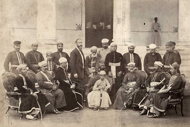 Salar Jung I (seated, third from left) with Asaf Jah VI (seated, center) and shams-ul-Umra II (seated, third from right) , c. 1870s.