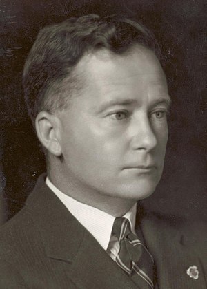 Formal head-and-shoulders portrait of Thomas White in suit and tie