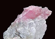 Tugtupite on quartz from Ilimaussaq complex Tugtupite 1.jpeg