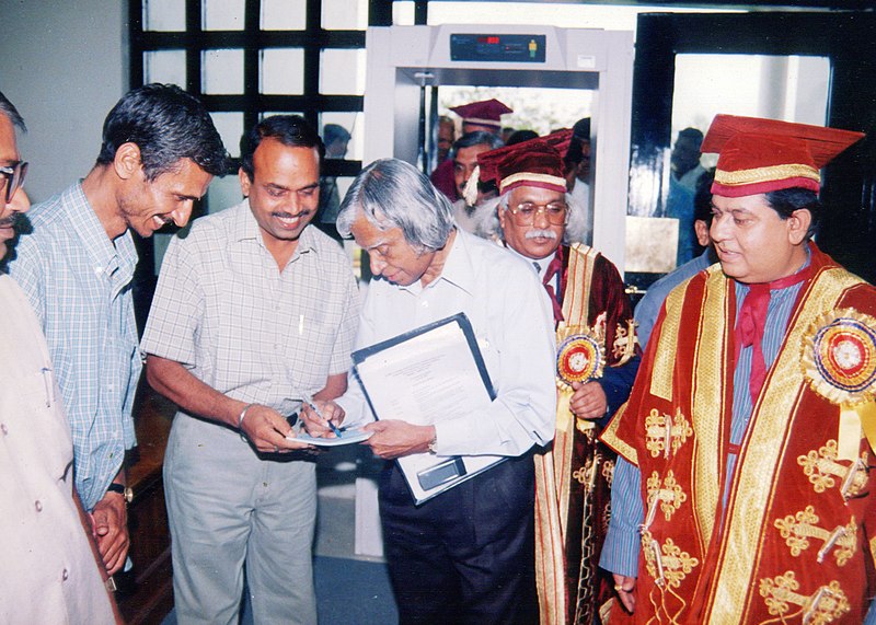 File:Vindhyeshwari Prasad Shukla (partially appearing at left) and Dr. Surendra Shukla (middle) receiving personal notations from A. P. J. Abdul Kalam in 2002.jpg