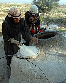 Woman making flat bread, Tamuz, Iraq.jpg