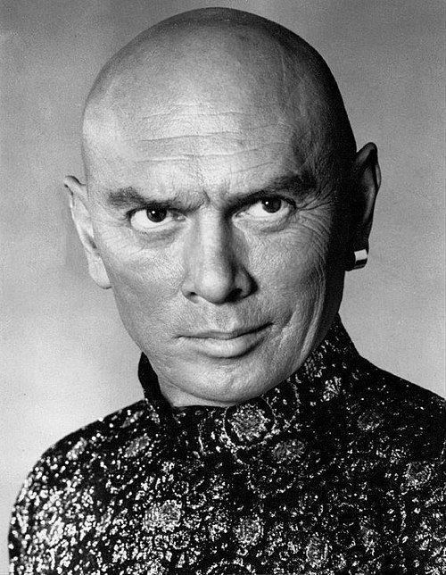 Actor Yul Brynner popularized a shaved head in the 1950s...