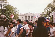 Demonstrators in front of the White House 09a.LGBT.MOW.25April1993 (23693190084).jpg