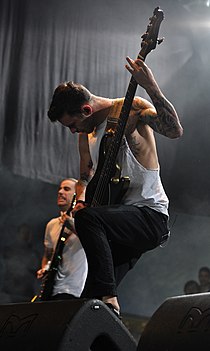 Bassist David Flinn and guitarist Jake Harmond (back) performing in 2013. 13-04-27 Groezrock Chelsea Grin 03.jpg