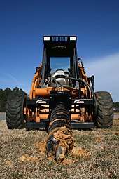 A skid-steer loader with an earth auger attachment. 2009-02-23 Skid steer with extreme duty auger.jpg