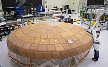 ASRC Federal technicians inspect AVCOAT block bonding on the Artemis II heat shield on at Kennedy Space Center on July 2, 2020. ASRC AVCOAT.jpg