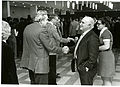 Dr. Ambler shakes hands at a reception in the NBS cafeteria