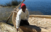 Amerindian man in his reed boat, on lake titicaca.png
