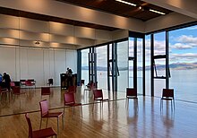 Gallery Suite west wall with full height mirror, seen during preparations for a Dance for Parkinson's class. The rooms are used for rehearsal and meetings as well as well as classes. Beacon Arts Centre Gallery Suite west mirror.jpg
