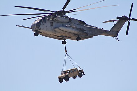 A CH-53 sling loads a HMMWV during a Marine Air-Ground Task Force demonstration