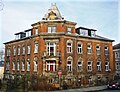 Tenement house with fencing in a corner and open development