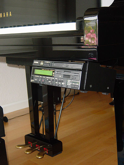 The Yamaha Disklavier player piano. The unit mounted under the keyboard of the piano can play MIDI or audio software on its CD.