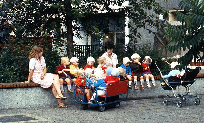 East Berlin child minders, with multiple-seat prams in 1984