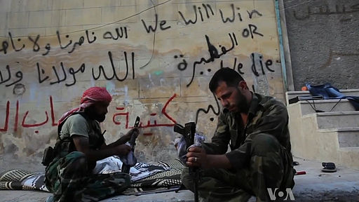 FSA rebels cleaning their AK47s