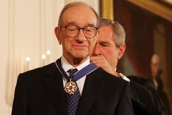 President George W. Bush presents the Presidential Medal of Freedom to Alan Greenspan, on November 9, 2005, in the East Room of the White House.