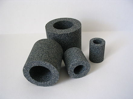 Assorted grinding wheels as examples of bonded abrasives.