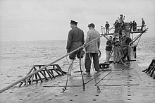 Filming aboard the Royal Navy submarine HMS Tribune, playing the role of "HMS Tyrant" in a propaganda film, 1943 HMS Tribune fiming 1943 IWM D 13211.jpg