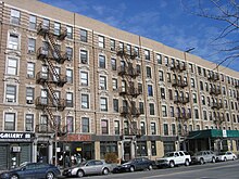 These buildings on West 135 Street were among the first in Harlem to be occupied entirely by blacks; in 1921, #135 became home to Young's Book Exchange, the first "Afrocentric" bookstore in Harlem. Harlem 135 street buildings.jpg