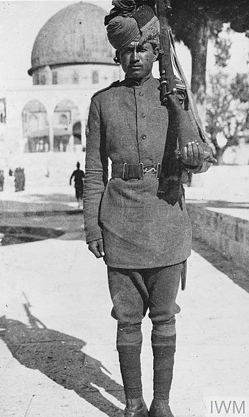 A sentry from 58th Vaughan's Rifles (Frontier Force), 75th Division guards over the Dome of the Rock, Jerusalem, during the Sinai and Palestine Campai