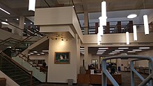 Jane Bancroft Cook Portrait and Book Stacks Above JCAndStacks.jpg