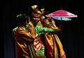 Dancers in traditional Malay costume during a dance