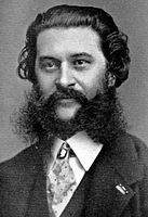 Johann Strauss II with a large beard, moustache, and sideburns.