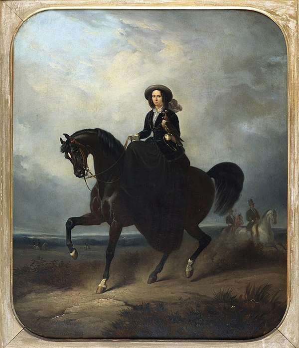 The Queen riding a horse