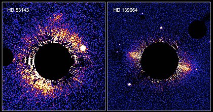 Debris discs around the stars HD 139664 and HD 53143 - black circle from camera hiding stars to display discs. Kuiper belt remote.jpg