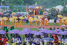 17 athletes from all participating regions lit the cauldron with a symbolic torch representing the tri-peoples of Davao del Norte. Lighting the Torch during Palarong Pambansa 2015 Opening Ceremony.jpg