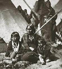 One of Little Crow's wives and two children at Fort Snelling internment compound, 1864 Little Crows wife and two children at Fort Snelling prison compound.jpeg