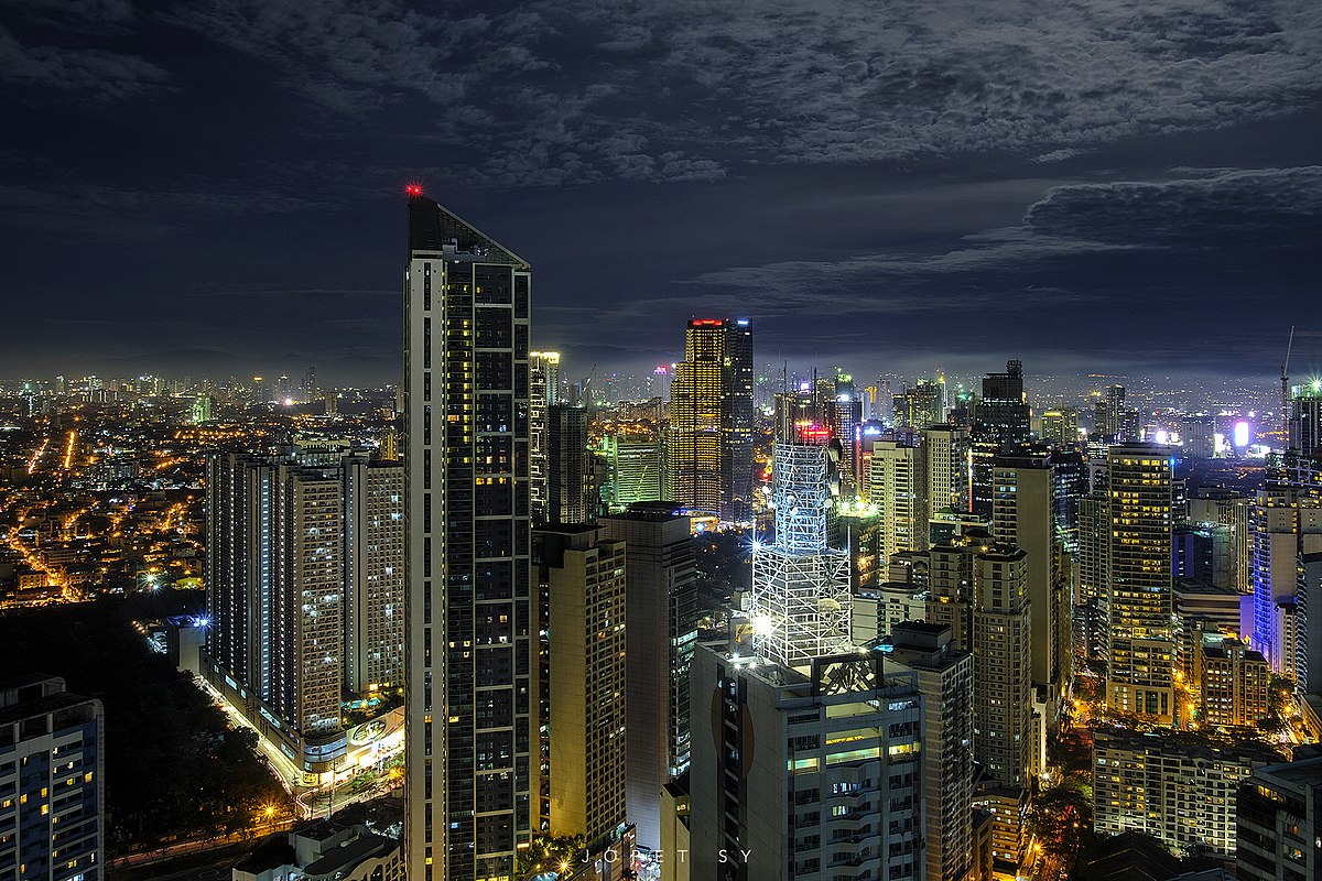 Philippines, Luzon, Manila. Makati business district with Louis