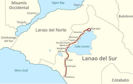 The "Peace Corridor" set up by combined forces of the Philippine government and Moro Islamic Liberation Front to hasten humanitarian efforts in support of affected Marawi residents. The orange line shows the scope of the corridor which covers Marawi itself and the towns of Marantao, Balindong, Tugaya, Bacolod-Kalawi, Madalum, Madamba, Ganassi, and Malabang. Marawi peace corridor.svg