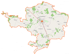 Mapa konturowa gminy Mońki, blisko centrum na prawo u góry znajduje się punkt z opisem „Hornostaje-Osada”