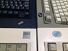 The square aluminium badge on a 1390131 series keyboard compared to other variants Model M Logo Comparison.jpg