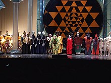 Nathan Gunn (center) as Papageno in Mozart's "The Magic Flute". Nathan Gunn (Papageno) The Magic Flute, The Metropolitan Opera (Flickr id 5434309243).jpg