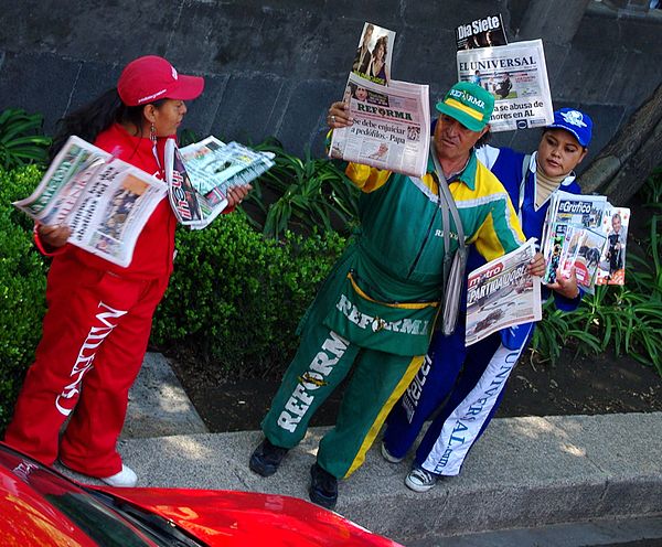 Uniformed newspaper vendors in Mexico City. Employers in some workplaces require their employees to wear a uniform.