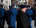 A veteran looks on as members of the Canadian Military march to the National War Memorial, during Remembrance Day ceremonies in Ottawa.