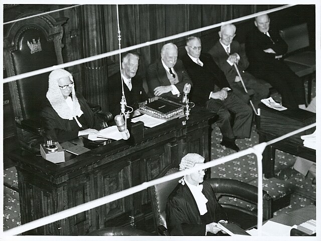 The Speaker, Ronald Algie (wearing a wig and robes), seated in the chair in the debating chamber, 1966