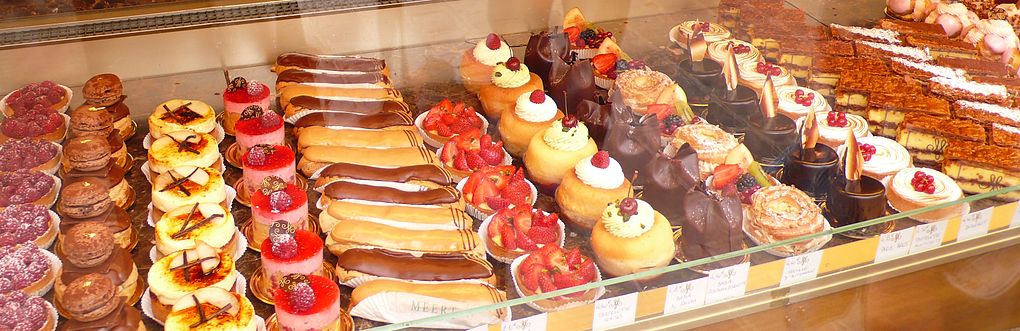 An assortment of pastries and cakes in a pâtisserie