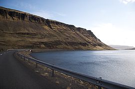 Road 47 in front of Múlafjall with eroded marine terraces and screes